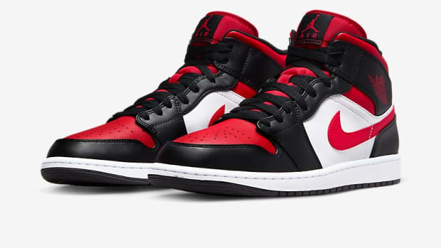 View of black, red, and white Air Jordan shoes.
